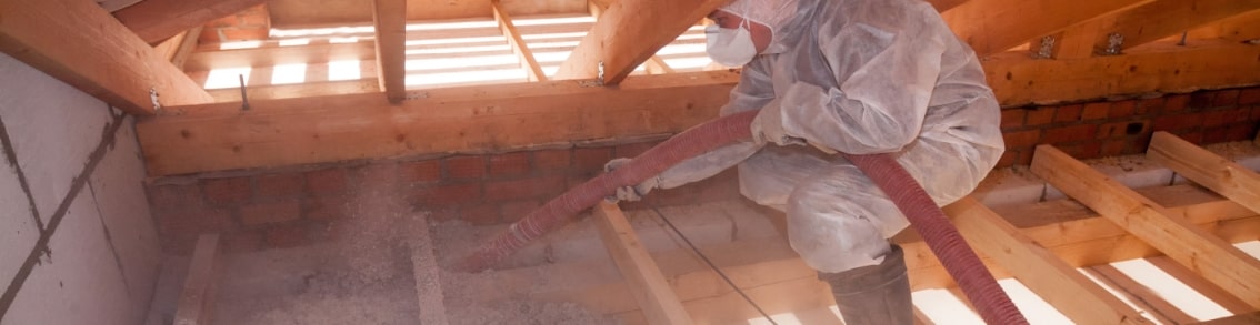 Man insulating attic